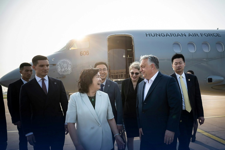 Orban was greeted at the airport by Chinese foreign ministry spokeswoman Hua Chunying (Handout)